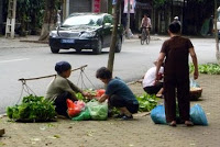 Traditional lifestyles co-exist with the modern - Hanoi photo